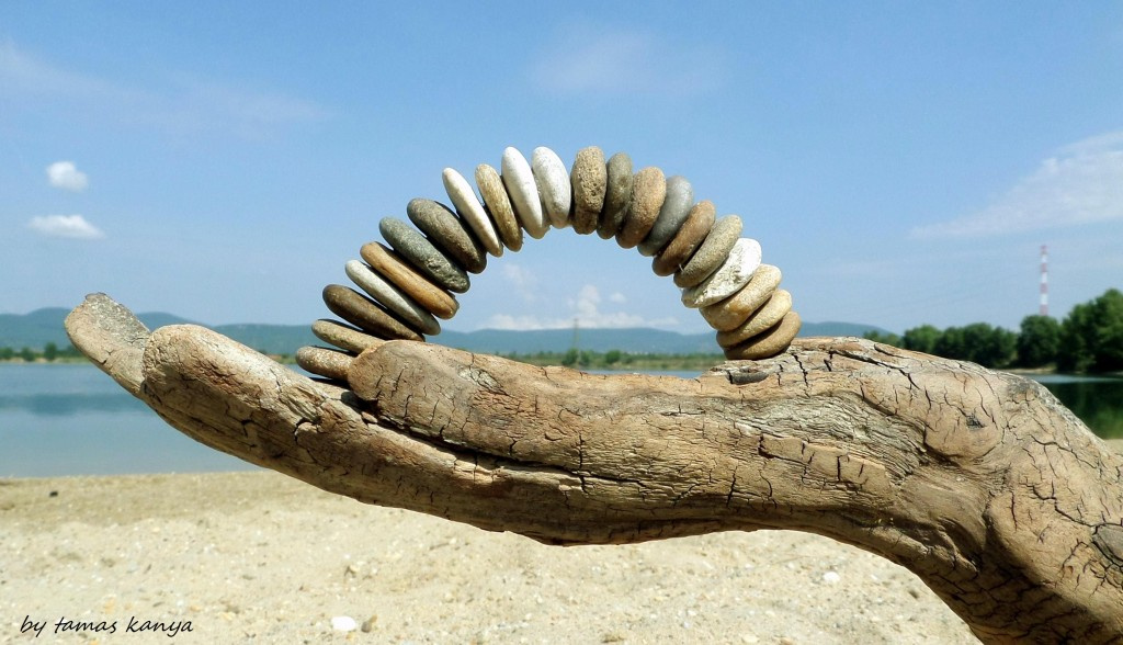 Driftwood hand and stone arch in hungary by tamas kanya