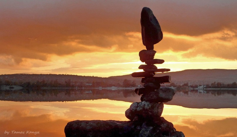Stone balance art in the sunset by tamas kanya