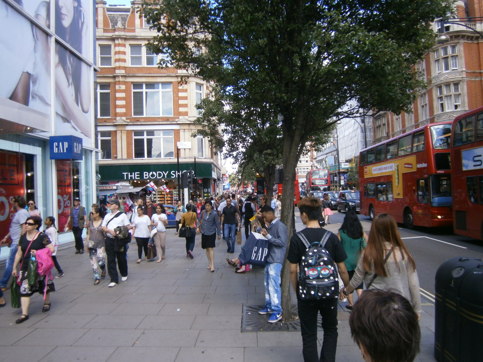 D4 teeming city street, London