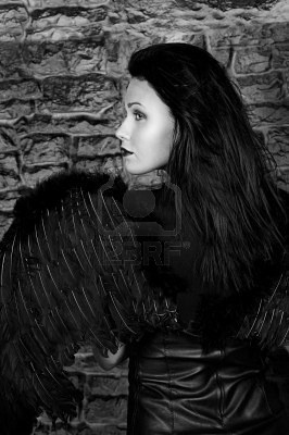 -the-beautiful-woman-with-black-wings-against-a-brick-wal