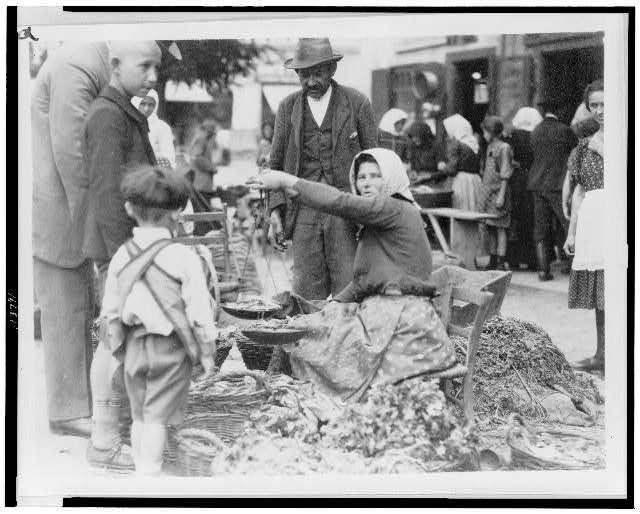 Woman selling vegetables in market, Hungary 1920-23