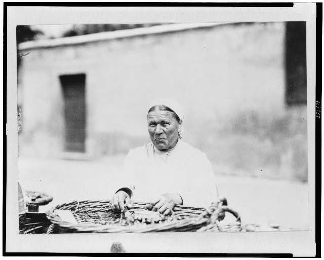 Woman with basket in market, Hungary 1920-1923