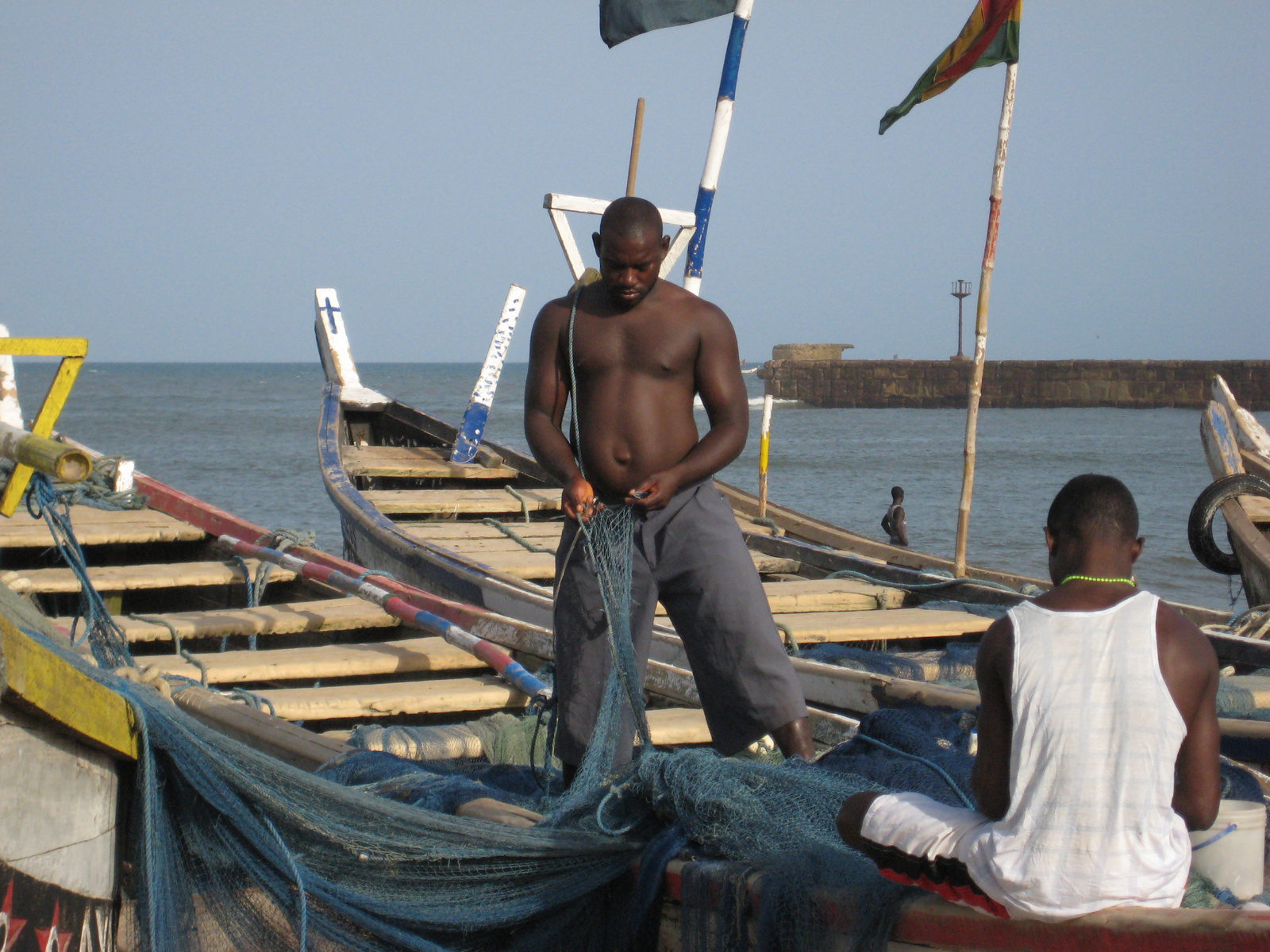 Fisherman mending his