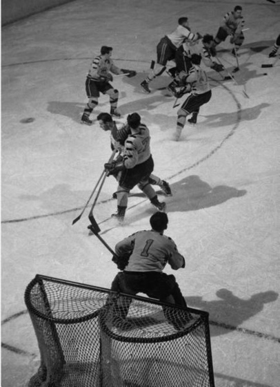 ce Hockey player Jean Believeau, playing with other Ice Hockey p