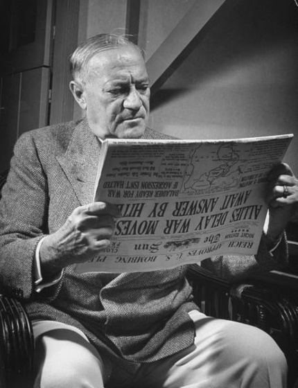 Senator Robert F. Wagner reading a newspaper