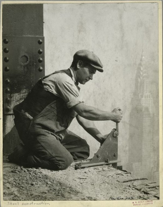 Worker-bolting-a-steel-support-1931-520x660