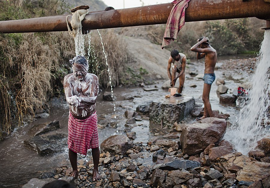 many-scavengers-bathe-in-public-after-a-days-work-at-the-mines