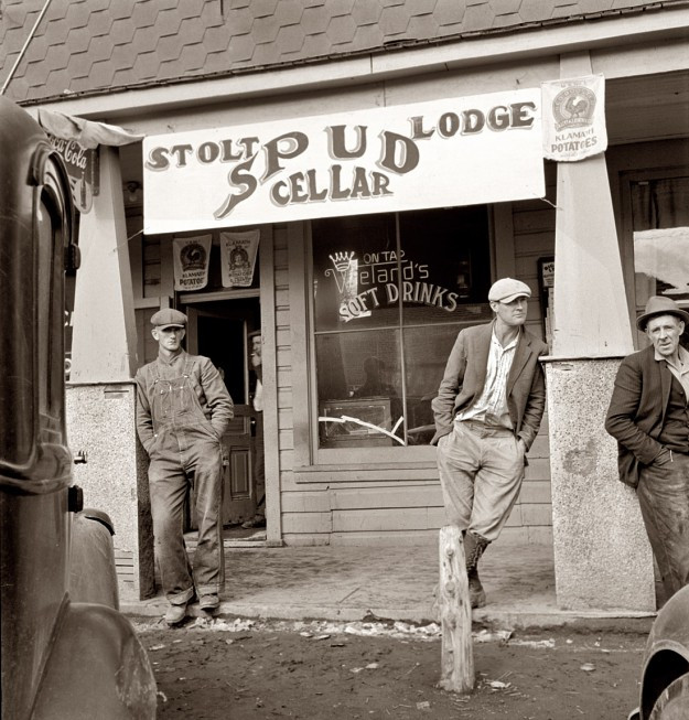 1939.Tavern on main street of potato town during harvest season.